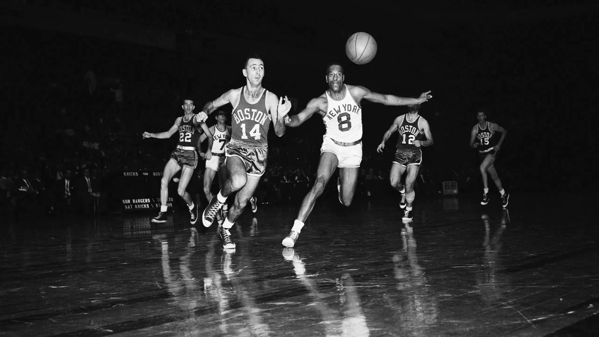 Cousy (14) against the Knicks at Madison Square Garden. New York got Zaslofsky.