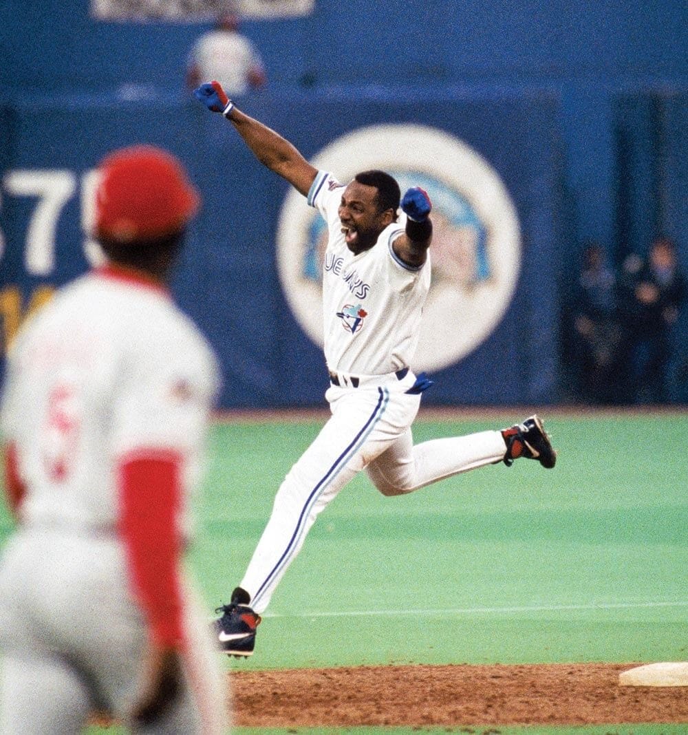 Carter heads for first base, and into history.