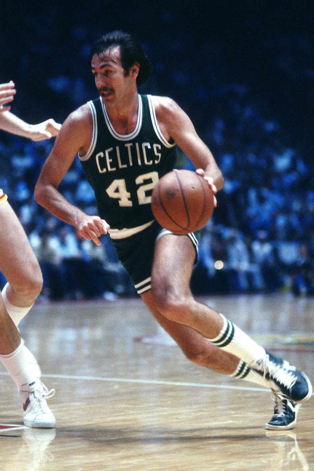 Ford (42) drives for Boston.