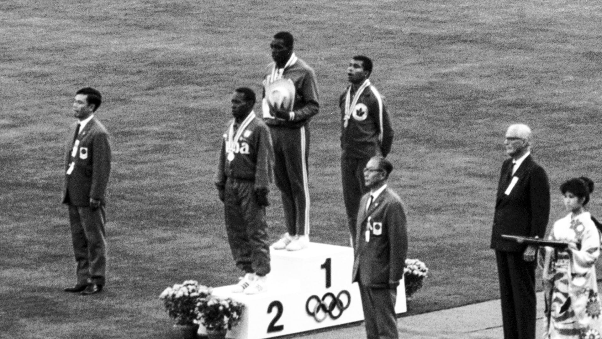Hayes on top of the 100-meter medal stand.
