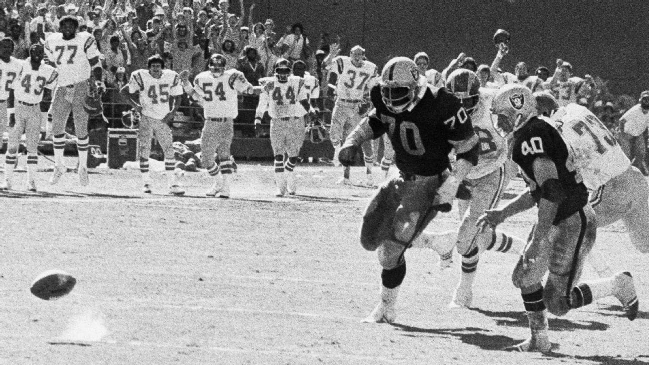 Raiders and Chargers chase the ball.