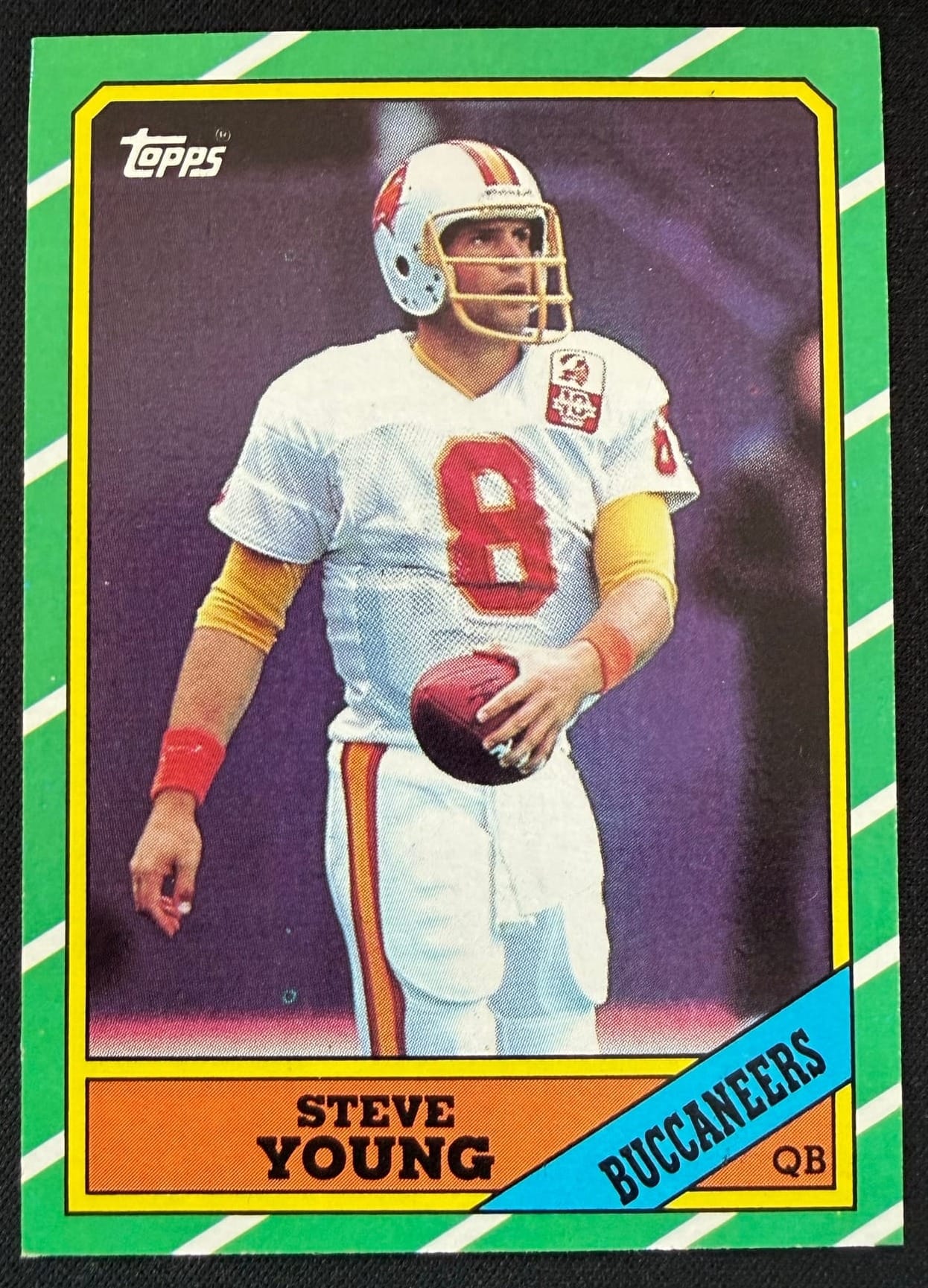 A 1986 Topps Steve Young. A bold border like this one makes centering easy to measure.