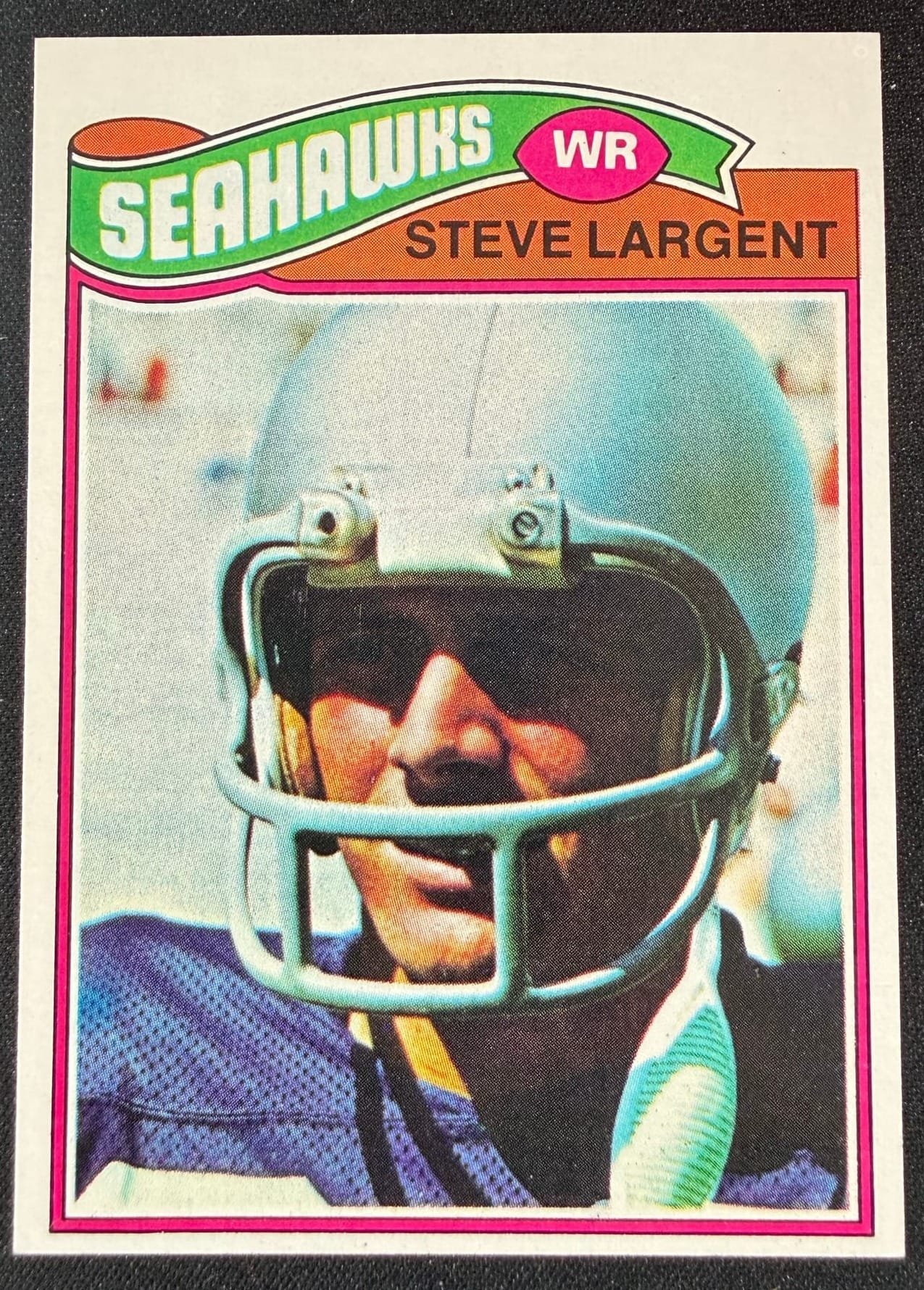 A 1977 Topps Steve Largent rookie card. Touched-up white borders are one of the things a UV light can show.