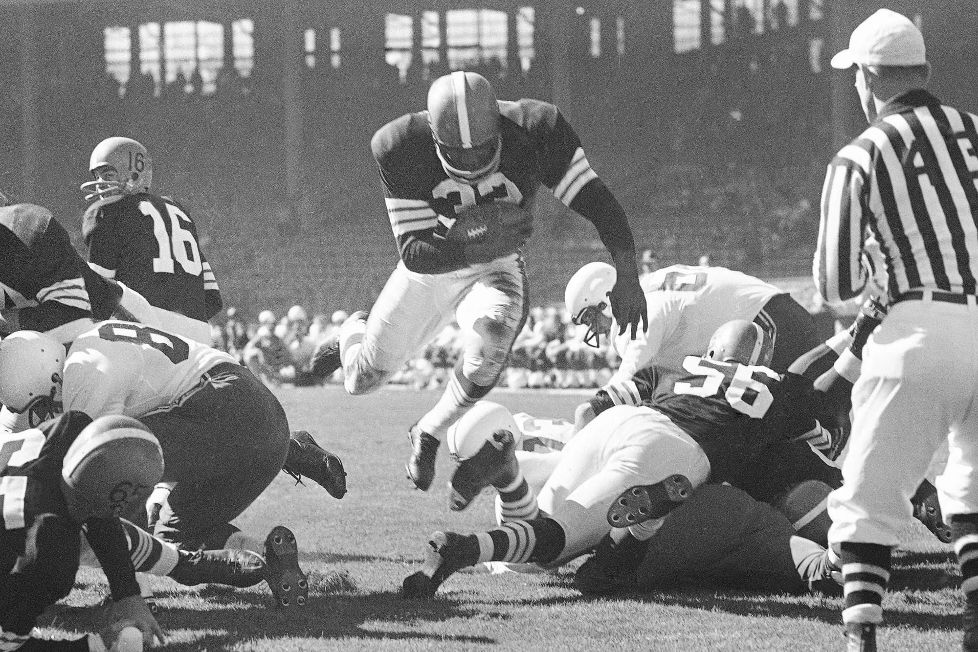Jim Brown (32) goes over the top.
