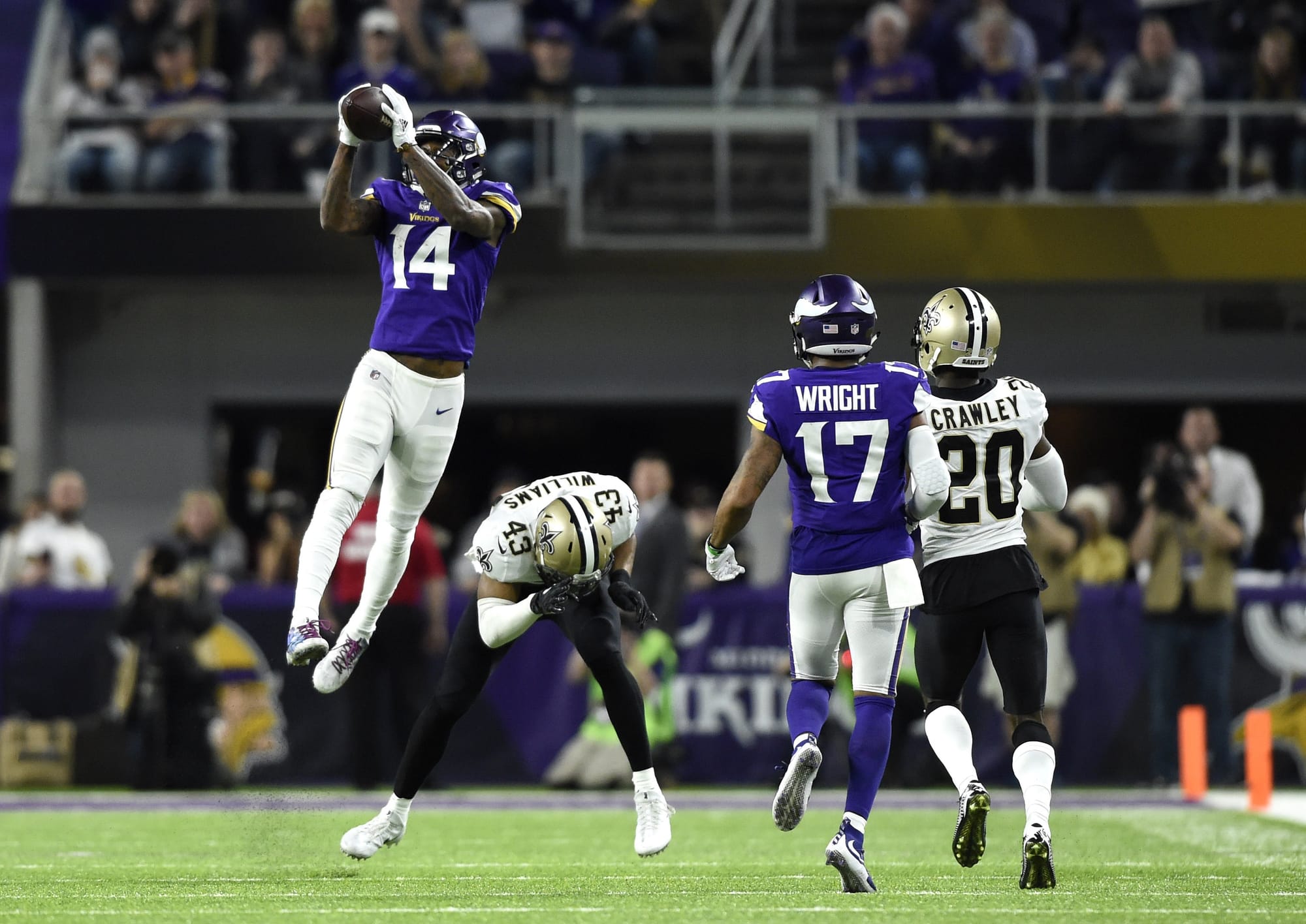 Stefon Diggs makes the catch at the sideline.