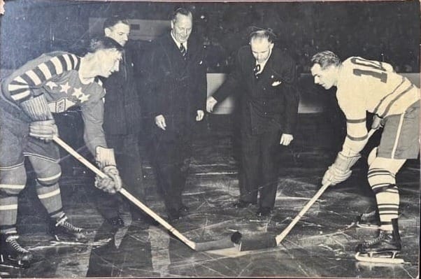 The ceremonial faceoff at Maple Leaf Gardens. Toronto's No. 10 is captain Syl Apps, who scored for the Leafs that night.
