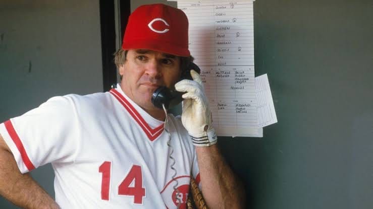 Rose in the Reds dugout during his years as manager.