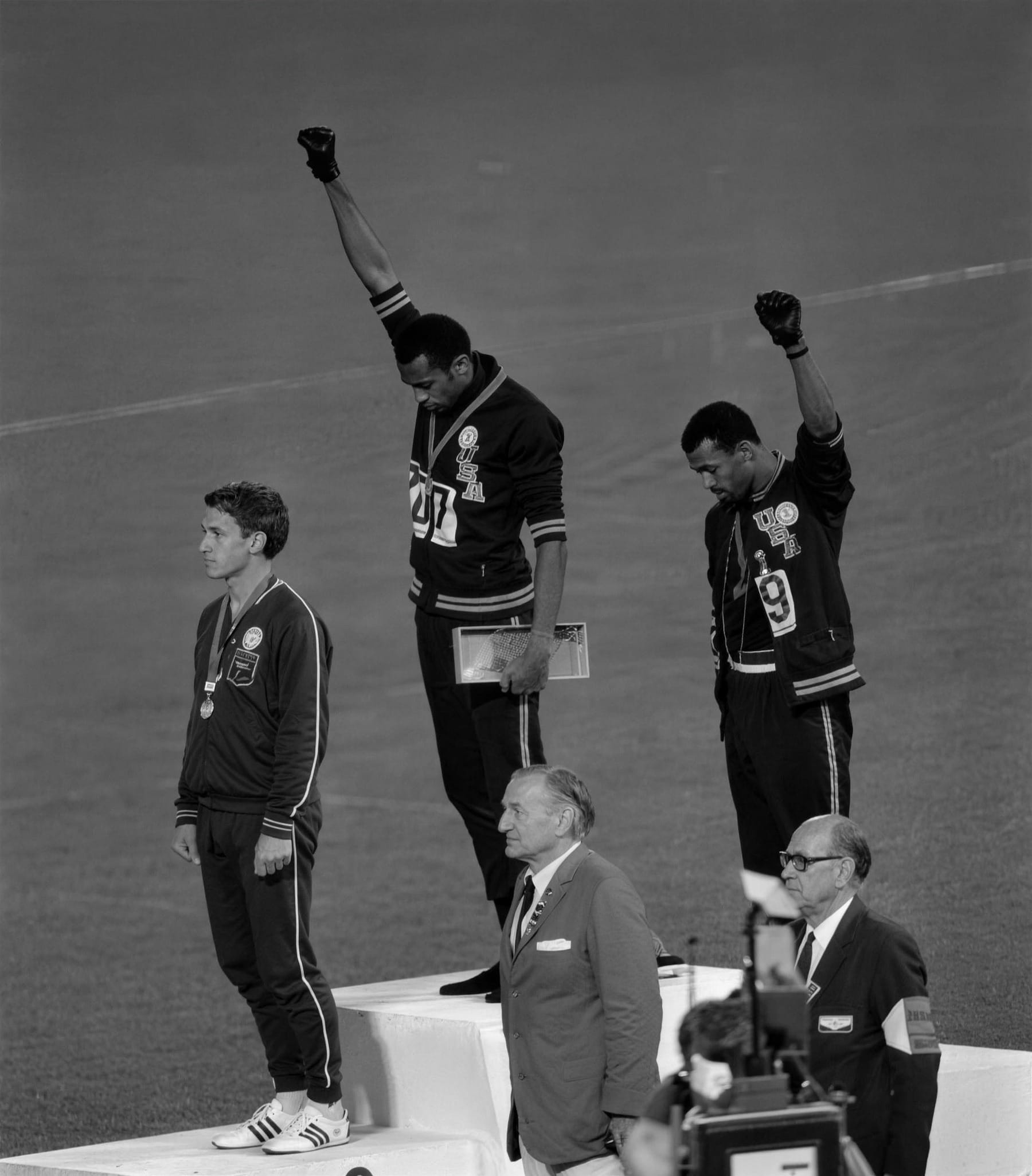 Heads bowed, fists raised, through the whole anthem.