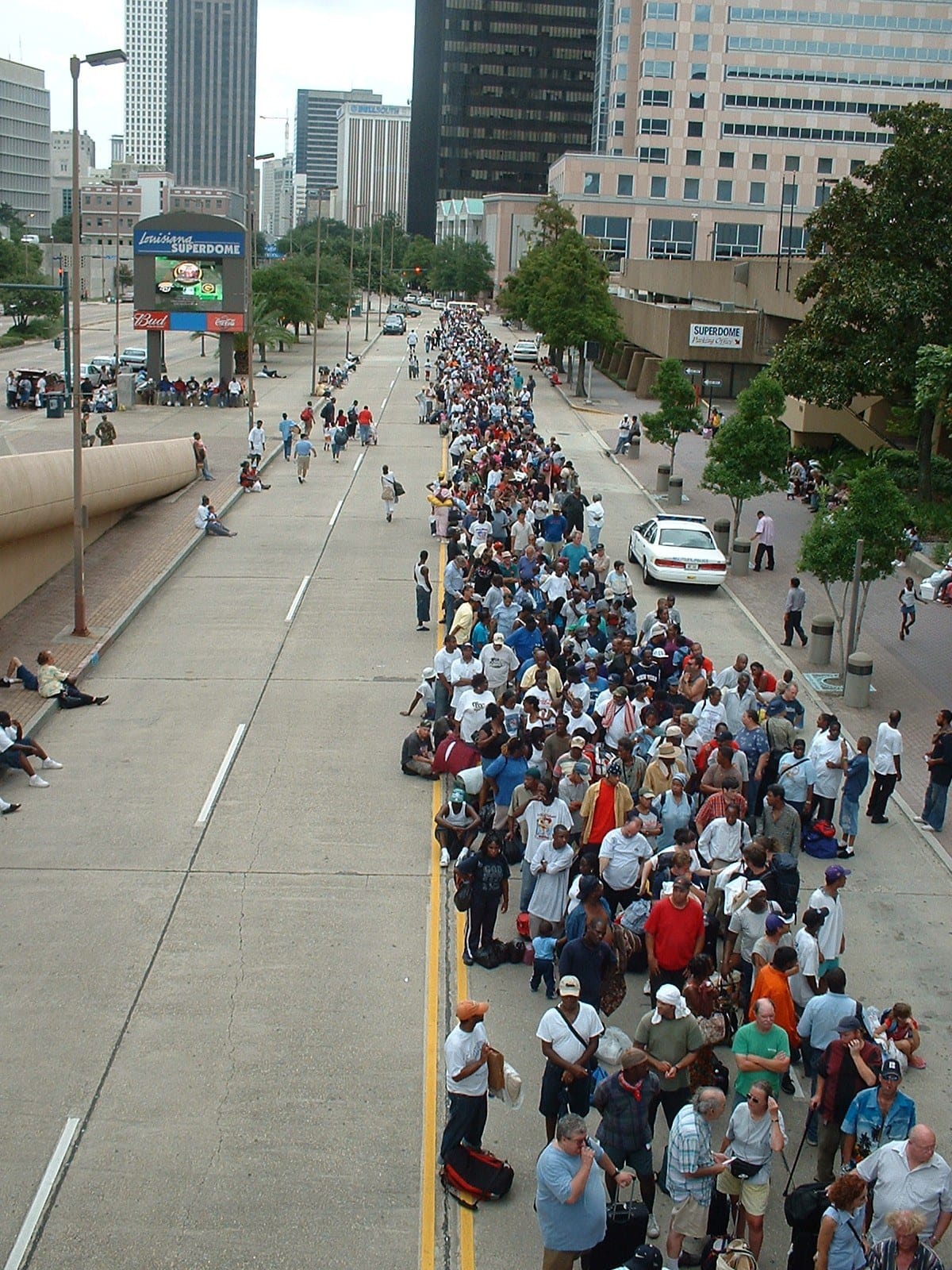Residents line up outside the Superdome with what they could carry on Aug. 28, 2005, the day before Katrina made landfall. (Photo: Marty Bahamonde/FEMA)