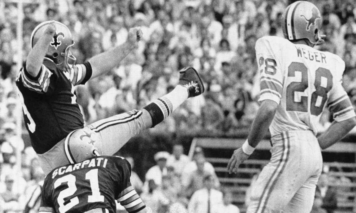Tom Dempsey's 63-yarder, Nov. 8, 1970. Joe Scarpati (21) holds.