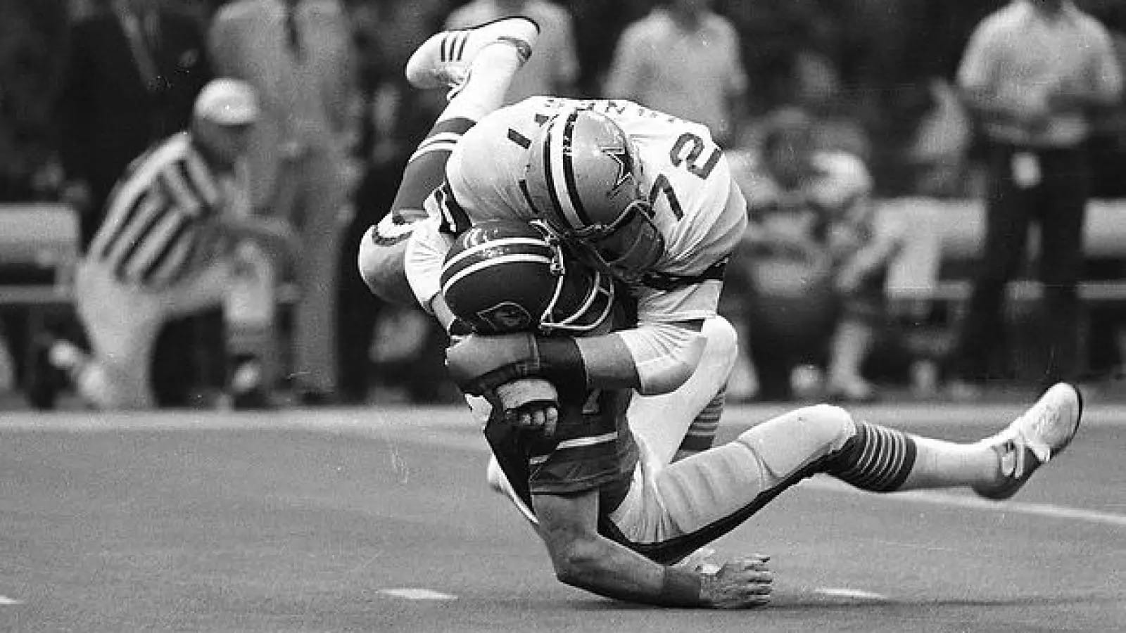 Ed "Too Tall" Jones (72) brings down a Bronco. Denver turned the ball over 8 times.