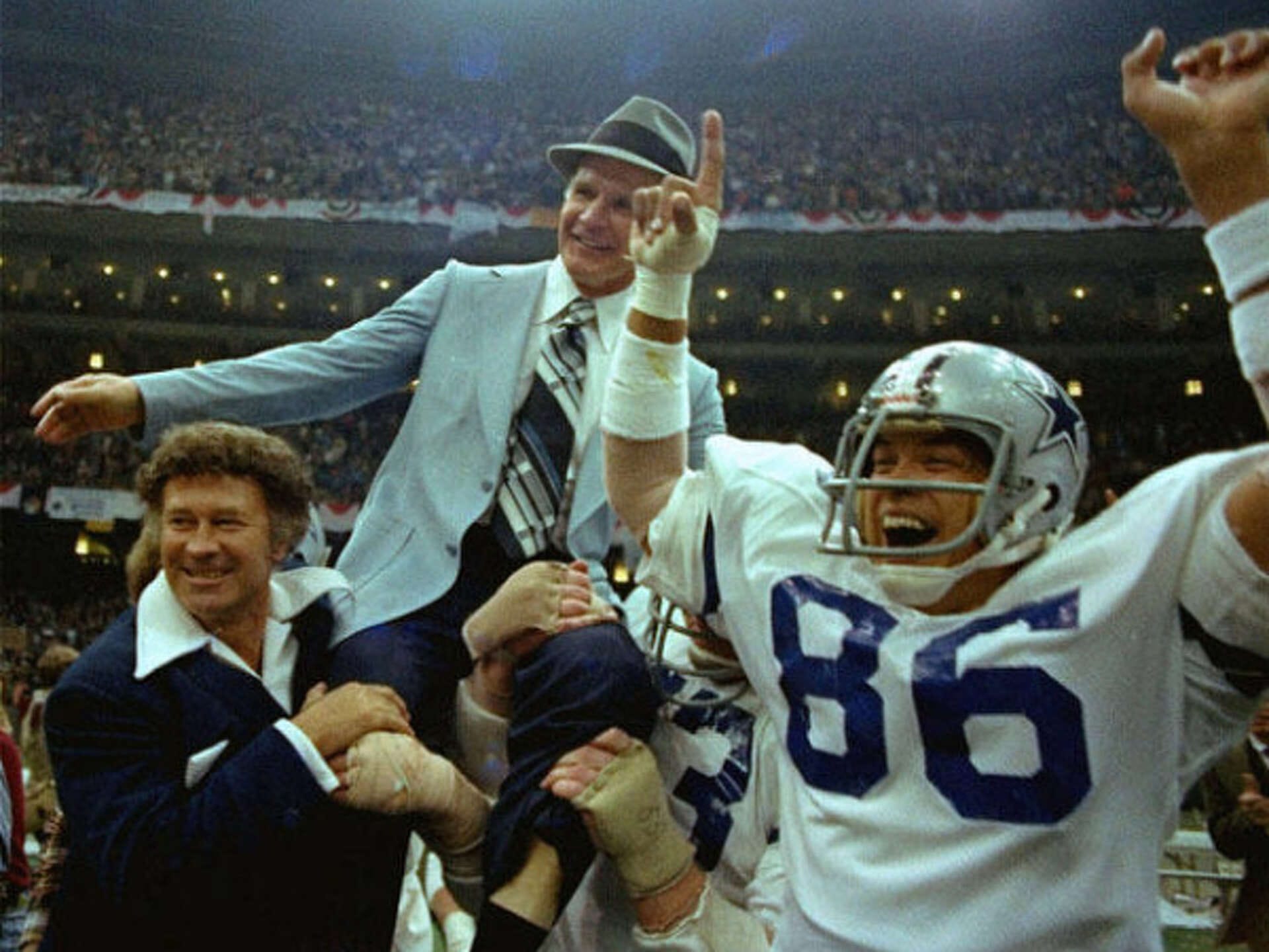 Tom Landry is carried off after Super Bowl XII, Ditka's second Super Bowl ring in Dallas.