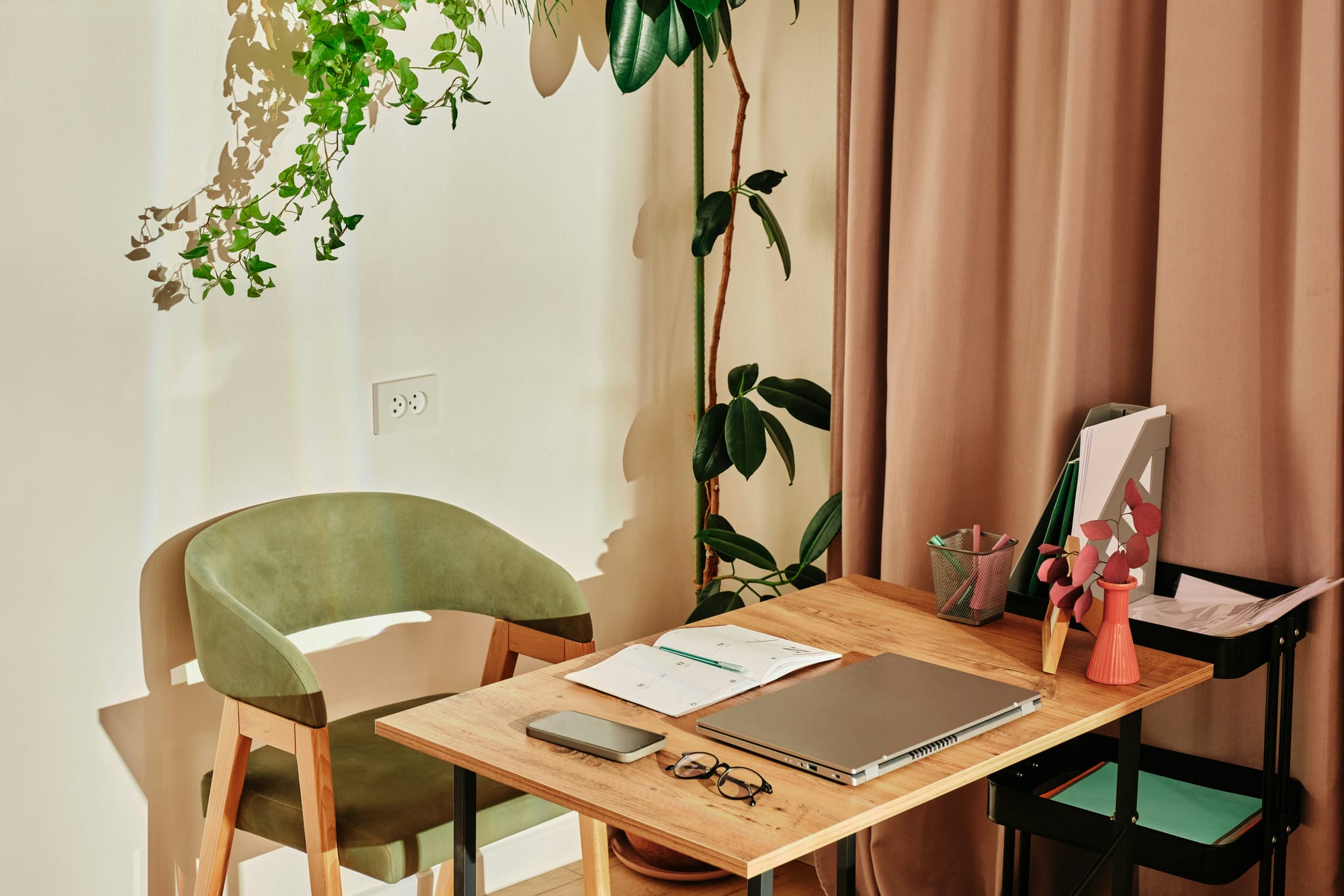 Clean ivory desk with open notebook, pen, and greenery — a serene study space representing clarity, focus, and functional medicine education.