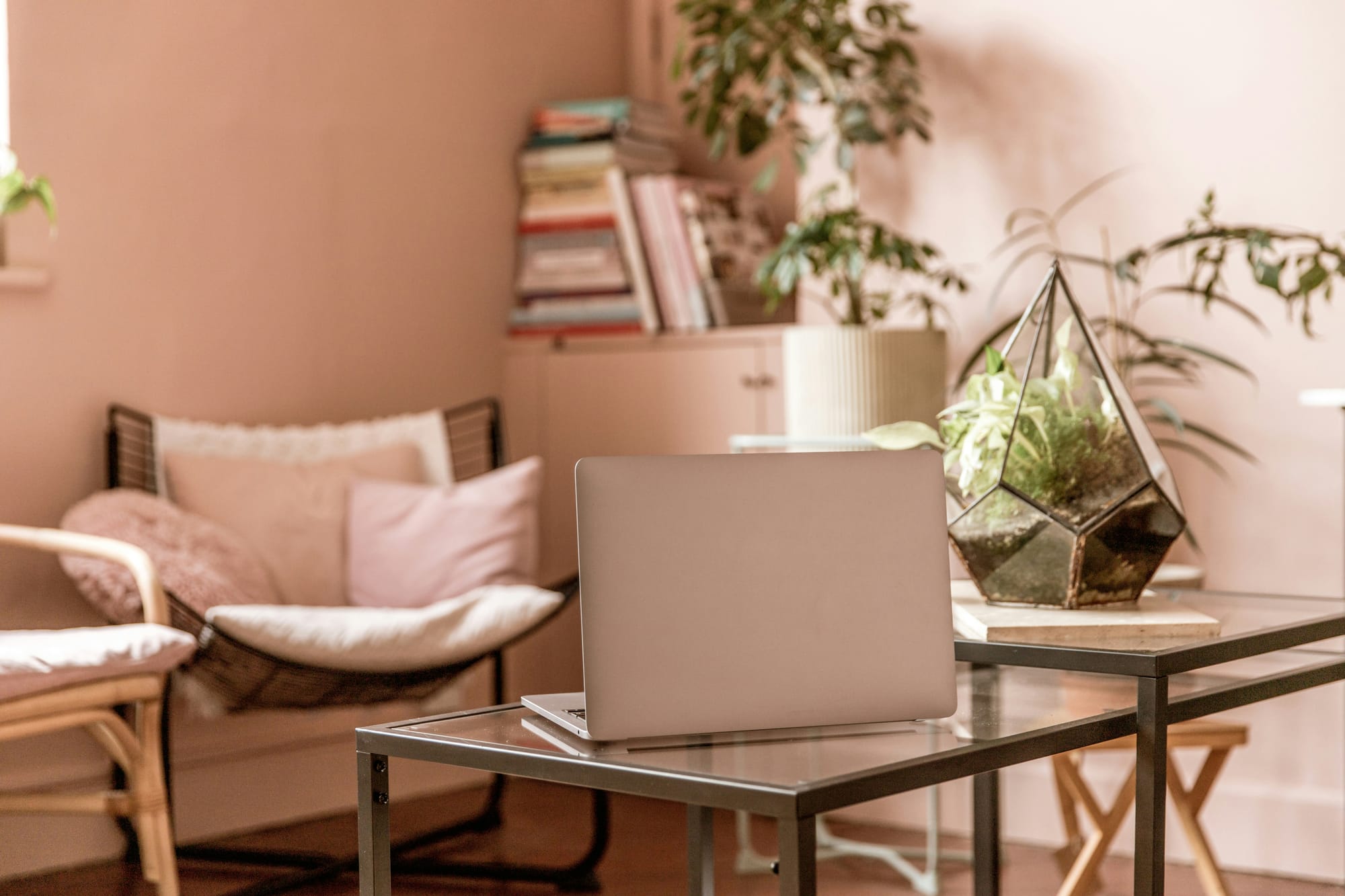 Ivory‑sage workspace with laptop and terrarium — a calm, science‑rooted environment for functional medicine education.