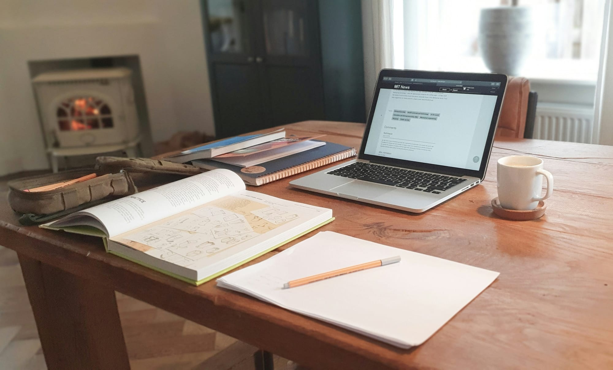 A warm ivory‑sage workspace with an open book, laptop, and coffee cup — symbolizing calm, structured, science‑rooted learning.