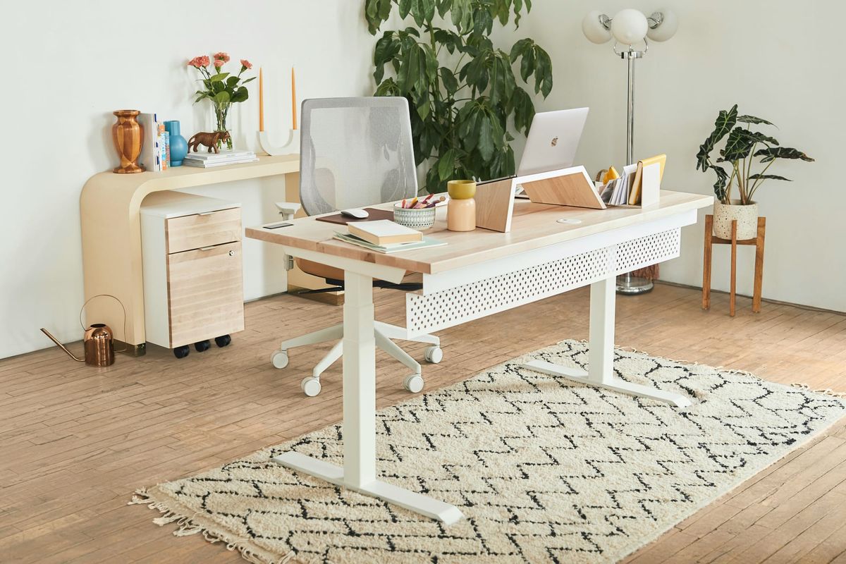 Calm ivory workspace with laptop, notebook, and soft natural light a minimalist functional medicine studio.