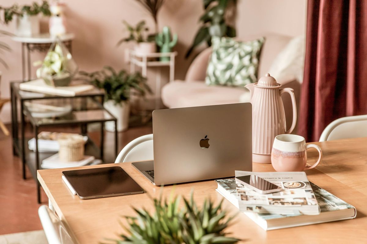Bright minimalist workspace with laptop, notebooks, and soft natural light — a calm environment symbolizing science‑rooted learning and structured healing.