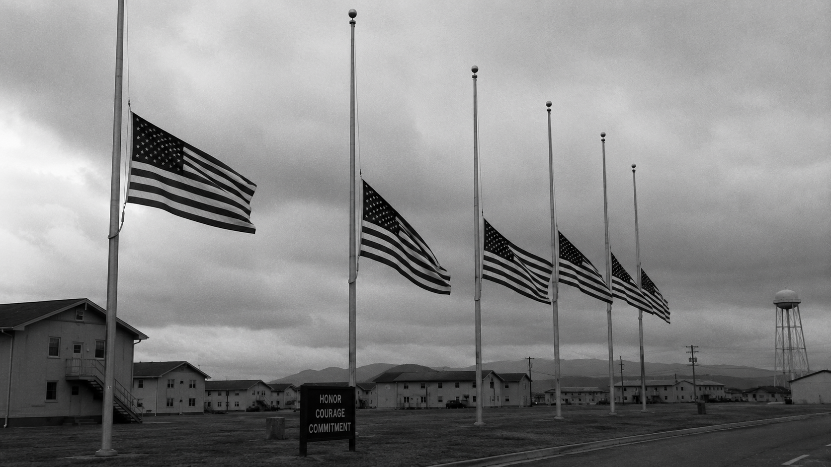 American flags half-staff military base