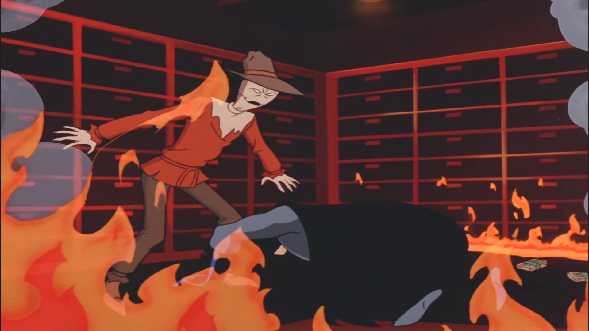 Batman cowers before The Scarecrow in the midst of his hallucinations. (Credit: Warner Bros.)