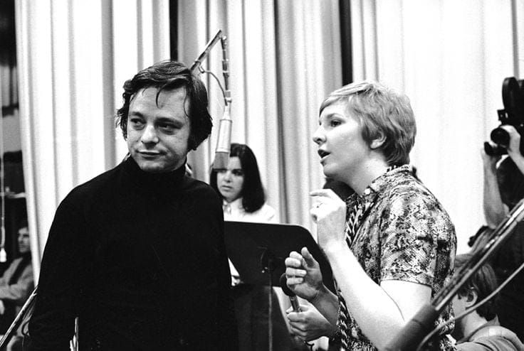 Stephen Sondheim looks off-camera while directing music during a recording of his musical Company.