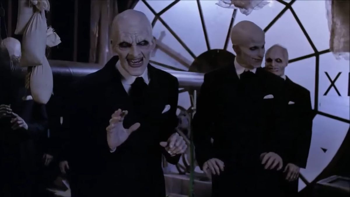 The Gentlemen in Buffy are bald, white-painted guys in suits with sharp teeth. They're inside a clock.