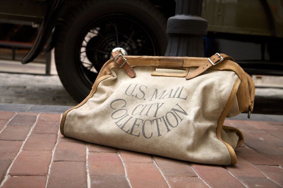 A vintage US Mail collection bag.