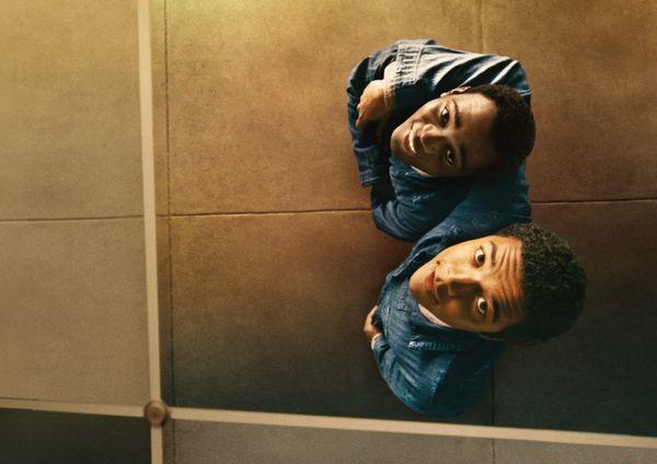The two protagonists of Nickel Boys look up at their reflection, smiling as they look at themselves.