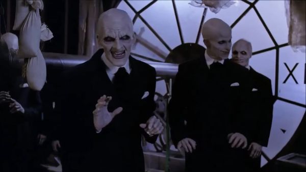 The Gentlemen in Buffy are bald, white-painted guys in suits with sharp teeth. They're inside a clock.