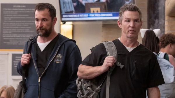 Noah Wyle and Shawn Hatosy star in The Pitt. They're both looking haggard and run down after a long day.