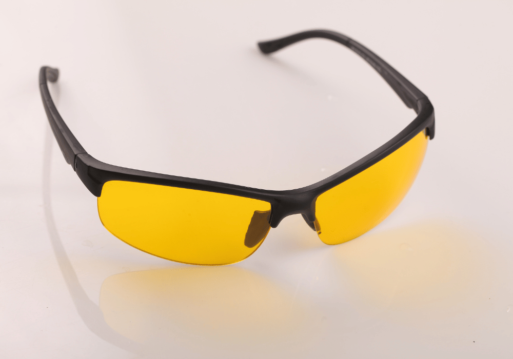 A person wearing blue light glasses to protect their eyes from the harmful effects of blue light