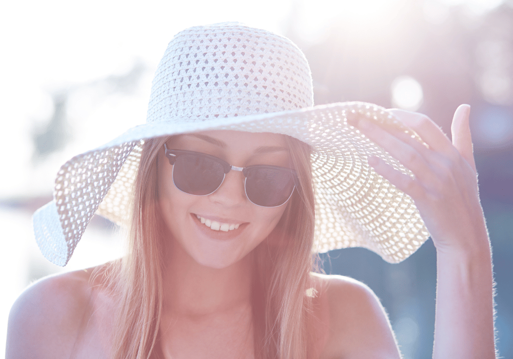 A person wearing blue light glasses and looking at a device with a blue light filter and being protected from the harmful effects of blue light