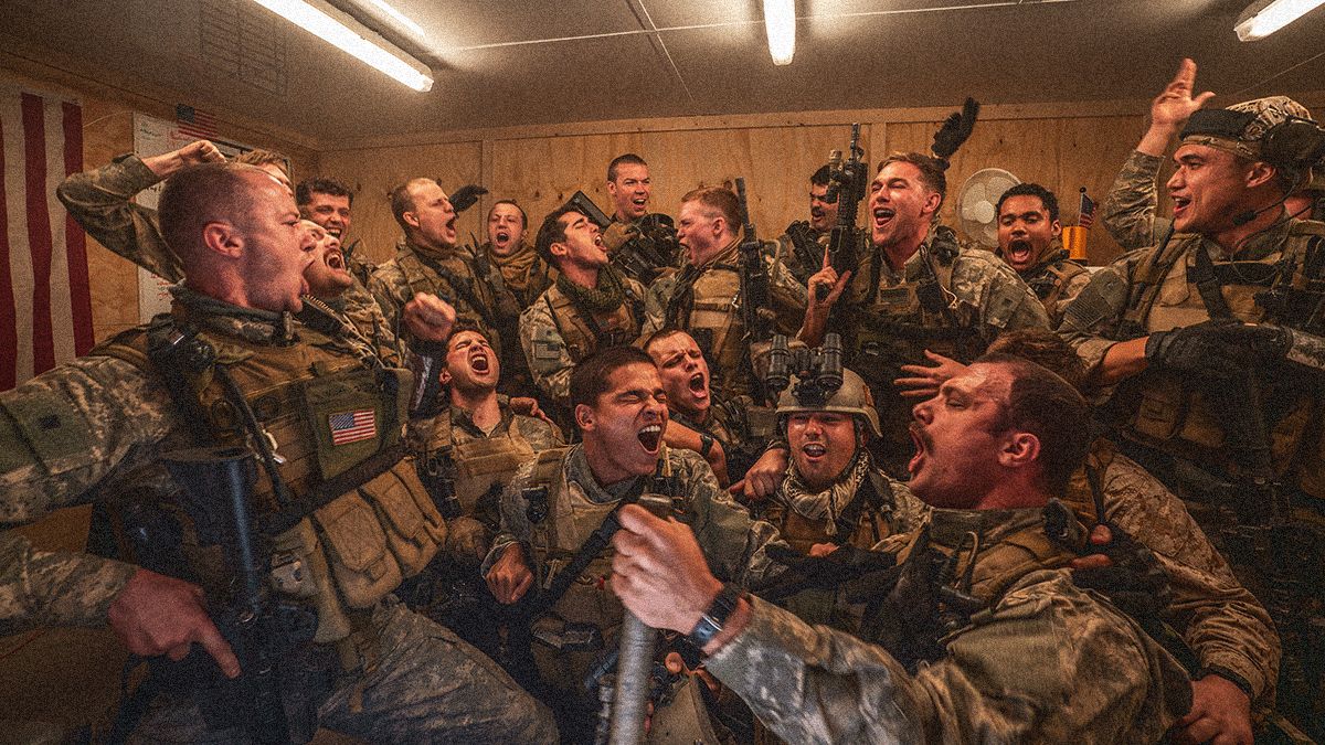 A group of Navy SEALs crowded into frame singing and dancing and having a great time.
