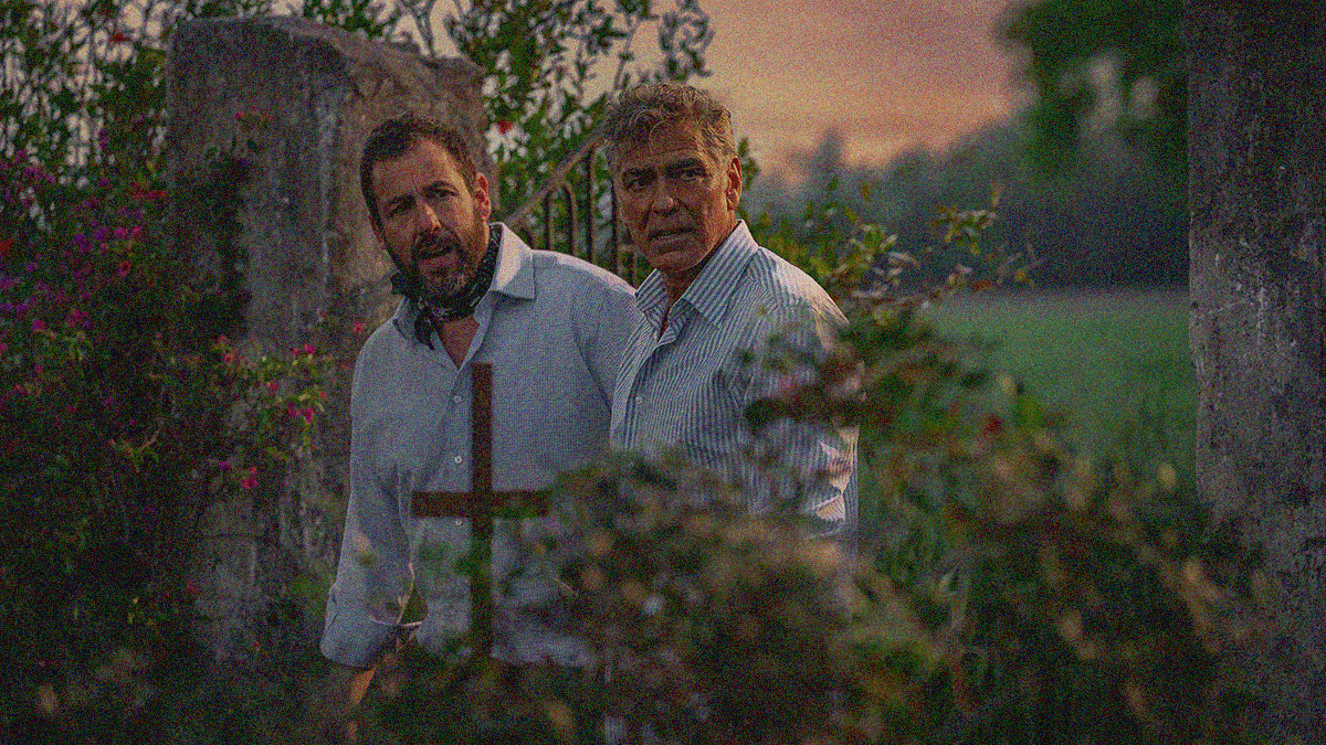Two men in button-downs look tired and disheveled outside in an overgrown cemetery.