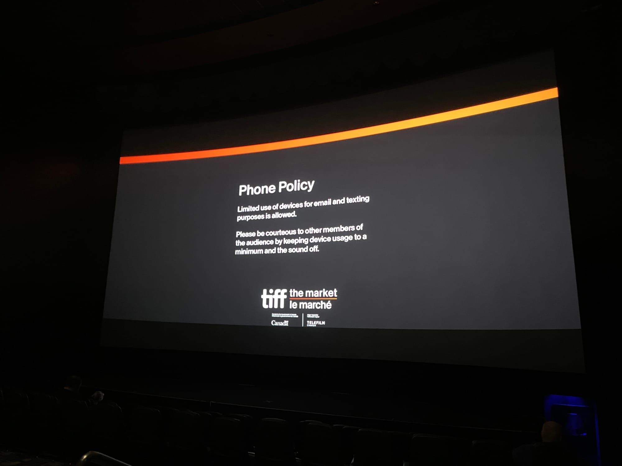 Black screen with white text: Phone Policy - Limited use of devices for email and texting purposes is allowed. - Please be courteous to other members of the audience by keeping device usage to a minimum and the sound off.
