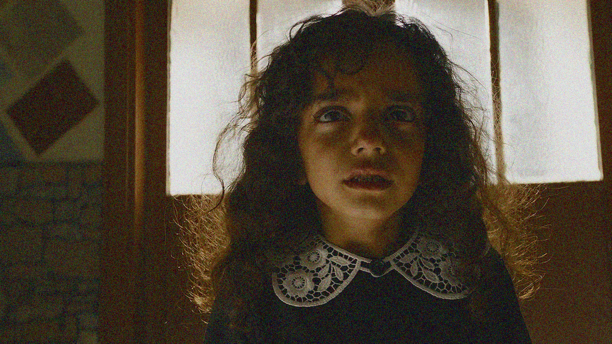 Close-up of a young girl tearing up to cry.