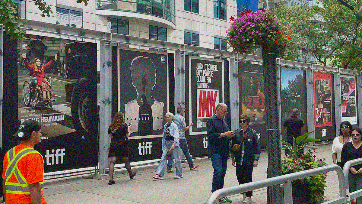A wall of posters outside on King Street opposite of the Princess of Wales Theatre.