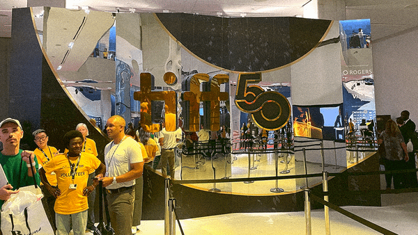 Image of the TIFF50 mirror wall at Lightbox with the commemorative logo in the center.