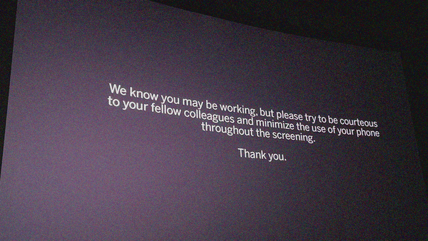 Message about phone use during press screenings asking to "minimize" rather than stop.