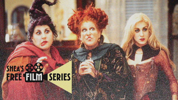 Three witches look off-screen with funny faces. Shea's Free Film Series logo puts "Film" in a projector and "Series" in a yellow triangle beam of light.