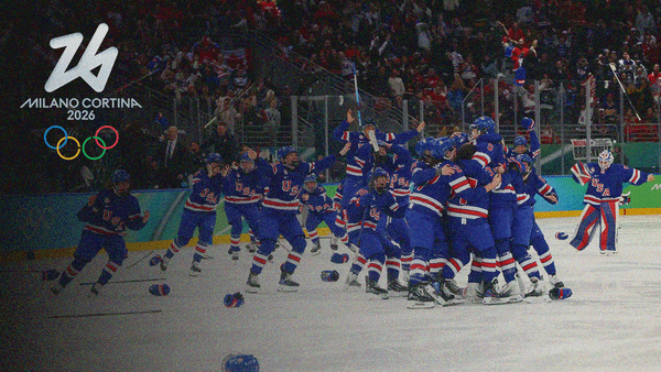 Team USA women's team celebrating on the ice after winning gold.