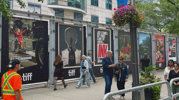 A wall of posters outside on King Street opposite of the Princess of Wales Theatre.