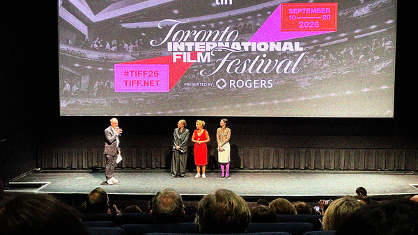 Four people on the TIFF Lightbox stage for a post-screening Q&A after WHAT LIES BETWEEN US.