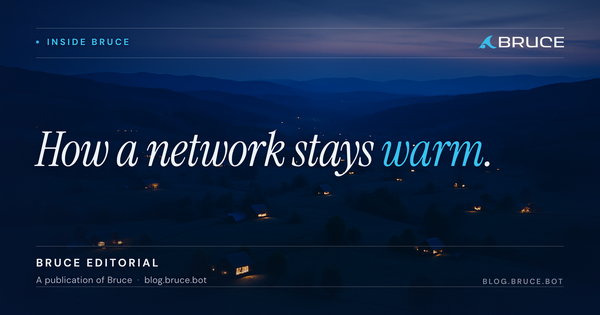 An aerial view at blue hour of a wide rural valley dotted with small farmhouses