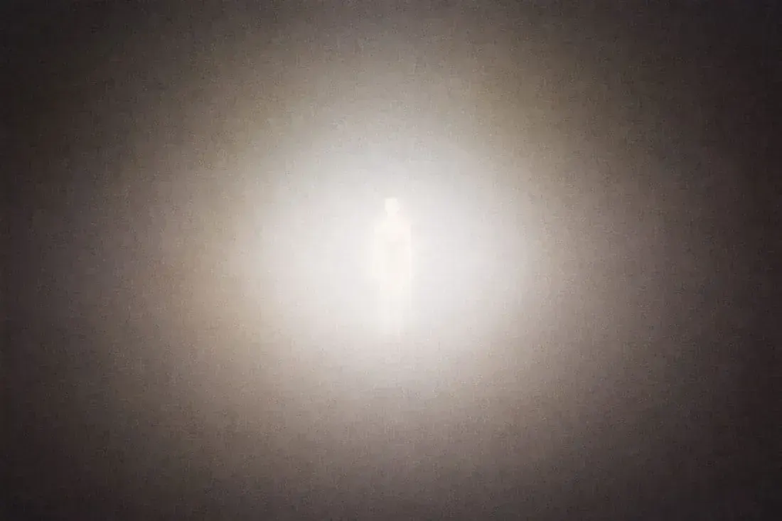A glowing human-like silhouette stands in the center of a hazy, light-filled space, surrounded by soft gradients. | Teachings from Khawaja Shamsuddin Azeemi.