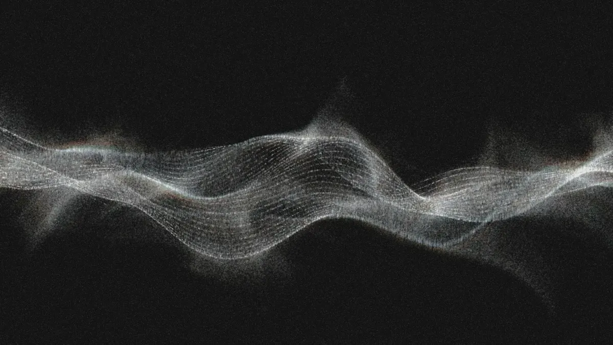 A luminous white particle wave undulates horizontally across a black background, its fine grid-like texture dissolving into scattered light at the edges | 