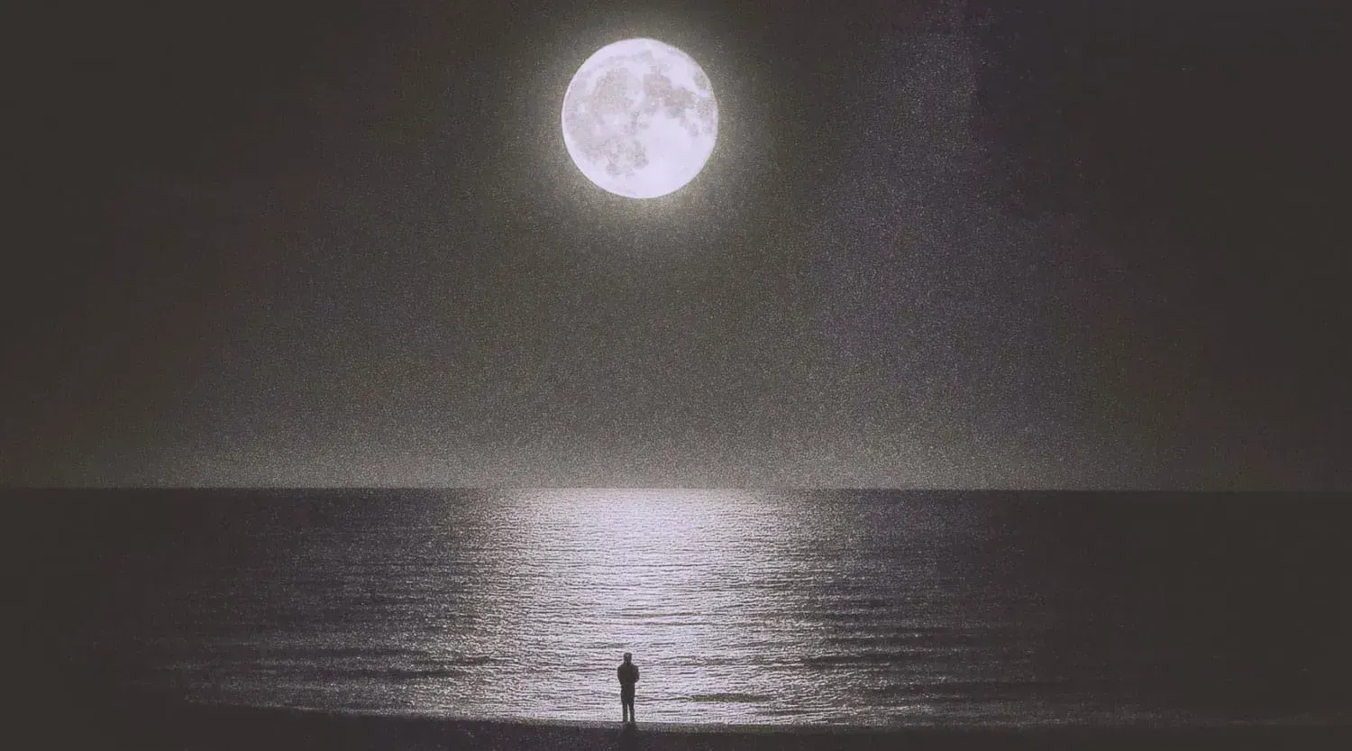 Man on the beach, staring at the bright moon with the reflection in the water. | Based on the teachings of Khawajah Shamsuddin Azeemi (RA)