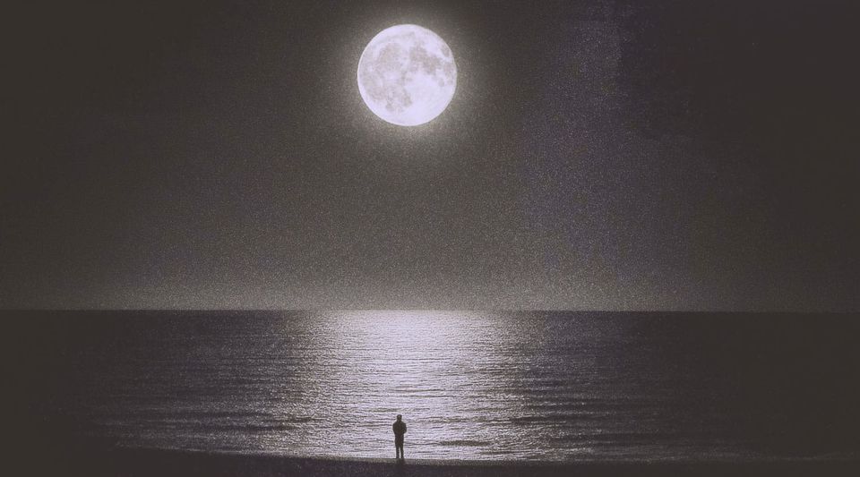 Man on the beach, staring at the bright moon with the reflection in the water. | Based on the teachings of Khawajah Shamsuddin Azeemi (RA)
