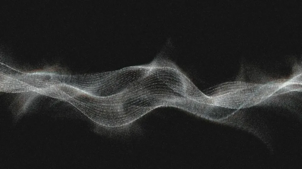 A luminous white particle wave undulates horizontally across a black background, its fine grid-like texture dissolving into scattered light at the edges | 