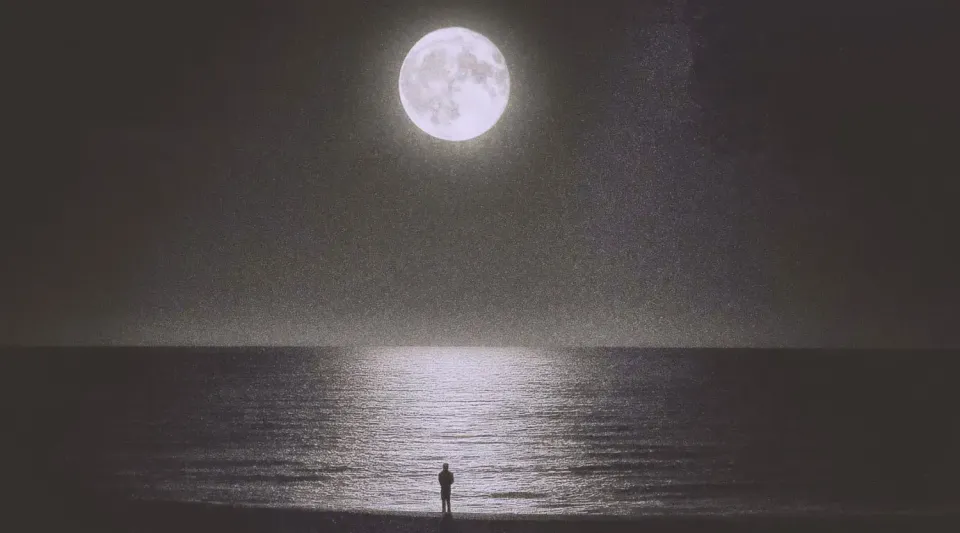Man on the beach, staring at the bright moon with the reflection in the water. | Based on the teachings of Khawajah Shamsuddin Azeemi (RA)