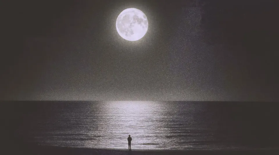 Man on the beach, staring at the bright moon with the reflection in the water. | Based on the teachings of Khawajah Shamsuddin Azeemi (RA)